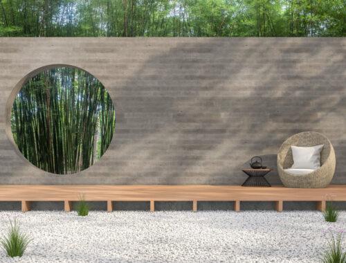 Moderner Garten-Stil, mit weißem Steinboden, Holzterrasse und Betonwand mit kreisförmigem Durchlass